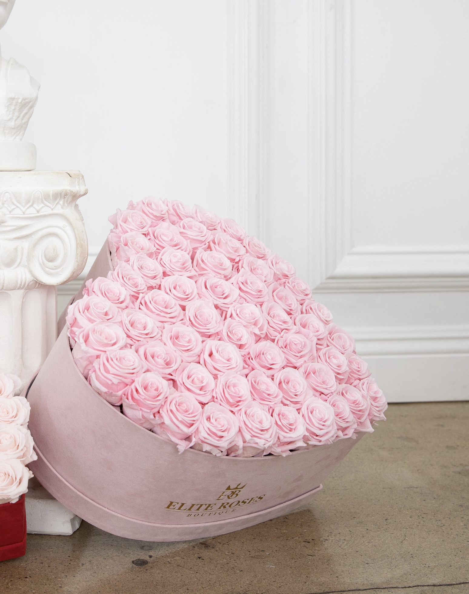 Pink roses in a large heart box